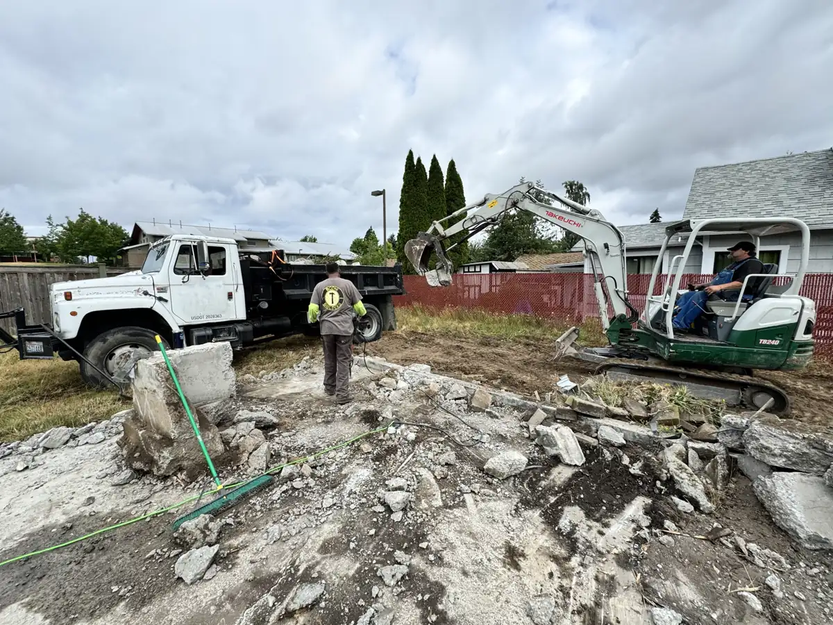 HULK mini excavator and crew breaking out an old foundation on a Tacoma demolition job